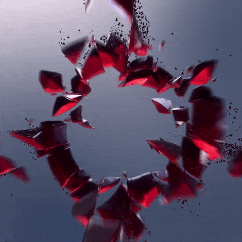 a circle of red pieces of glass against a blue background
