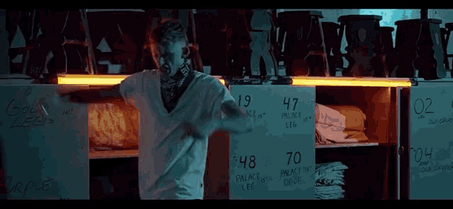 a man in a bandana is standing in front of a sign that says 19 47 and 70