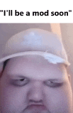 a man wearing a white hat with a white feather on his forehead