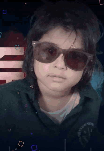 a young girl wearing sunglasses and a green shirt with the letters nv on it