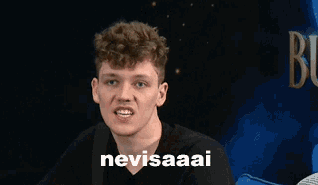 a young man is making a funny face with the words nevisaaai written on the bottom