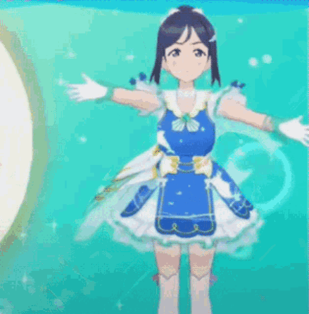 a girl in a blue and white dress is standing in the water