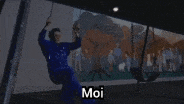 a person in a blue raincoat says moi in black letters