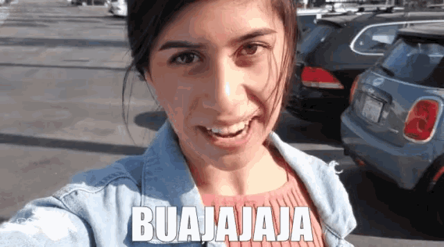 a woman taking a selfie with the caption buajajaja on the bottom