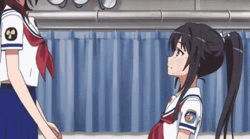 two anime girls are standing next to each other in a room with blue curtains .