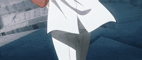 a man in a white shirt and black pants is walking