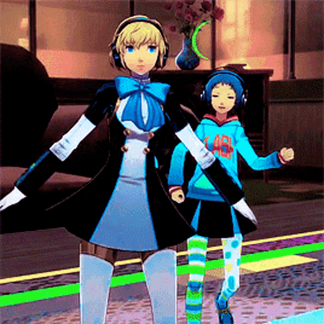 a girl wearing headphones is standing next to another girl wearing a hoodie that says ao on it