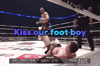 a boxing match with the words kiss our foot boy on the screen