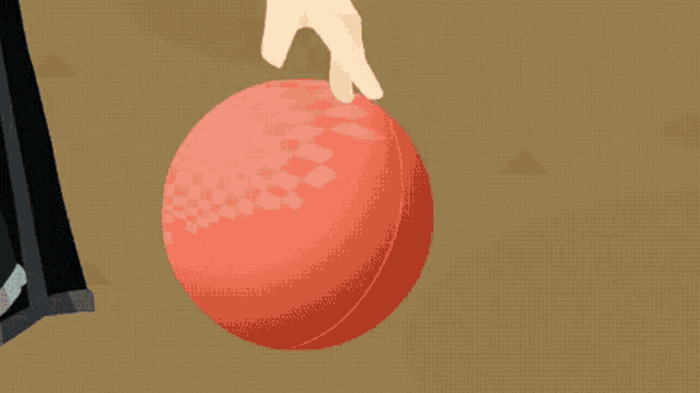 a man in a suit holds a bowling ball in his hand