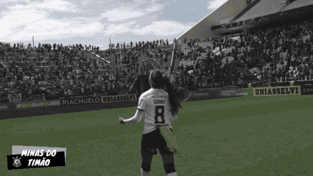 a female soccer player with the number 8 on her jersey