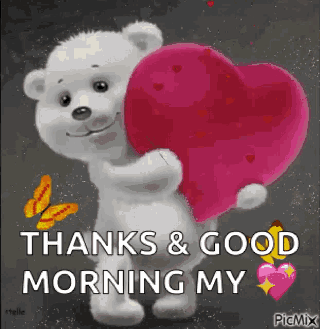 a teddy bear is holding a pink heart and saying thanks and good morning my heart .