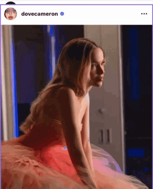 a picture of a woman in a pink dress with the name dove cameron on the bottom