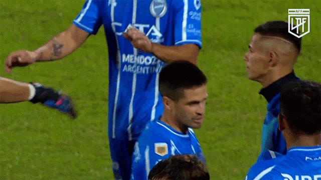 a group of soccer players wearing blue jerseys with mendoza argentina written on them