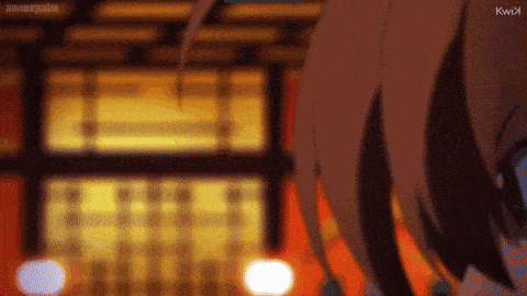 a close up of a person 's face with a blurry background and the letters kwix on the bottom right