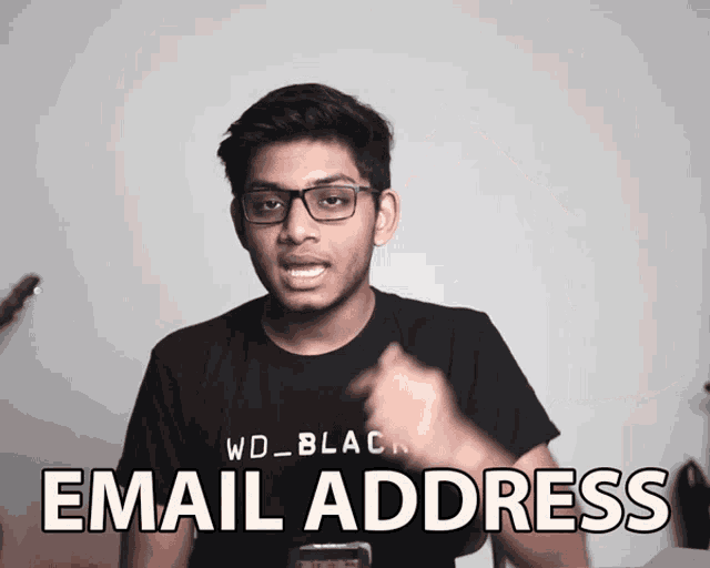 a man wearing glasses and a black shirt with the words email address on it
