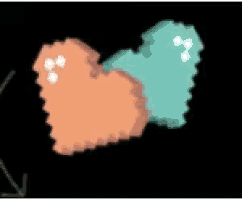 two hearts are sitting next to each other on a black background . one is orange and the other is blue .