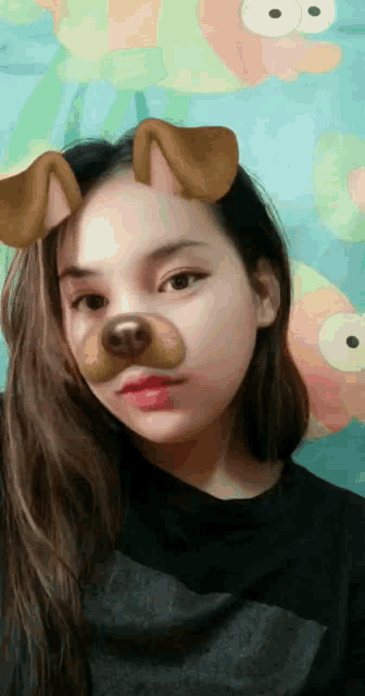 a girl with a dog mask on her face is taking a selfie