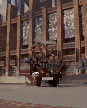 a car with a license plate that says ' bourne ' on it crashes into a building