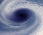 a blue and white swirl with a black hole in the middle .