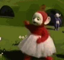 a red and white teddy bear is standing in a field wearing a white dress .