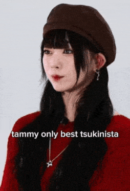 a woman wearing a hat and a red sweater says tammy only best tsukinista on the bottom