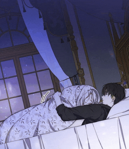 a man and a woman are laying on a bed