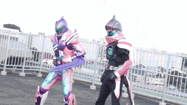 a man in a pink and purple costume is standing next to another man