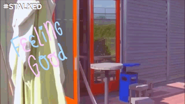 a sign that says " feeling good " is painted on a glass door