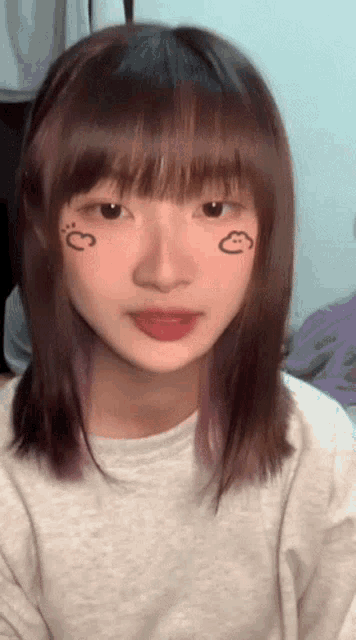 a girl with a heart drawn on her cheek