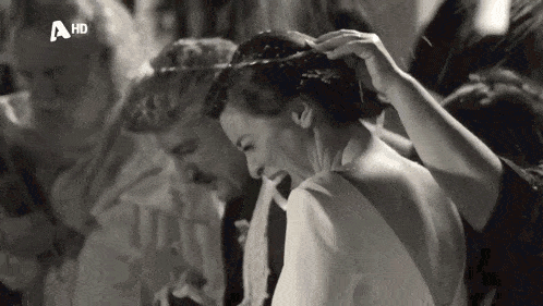 a black and white photo of a bride and groom with a hd watermark