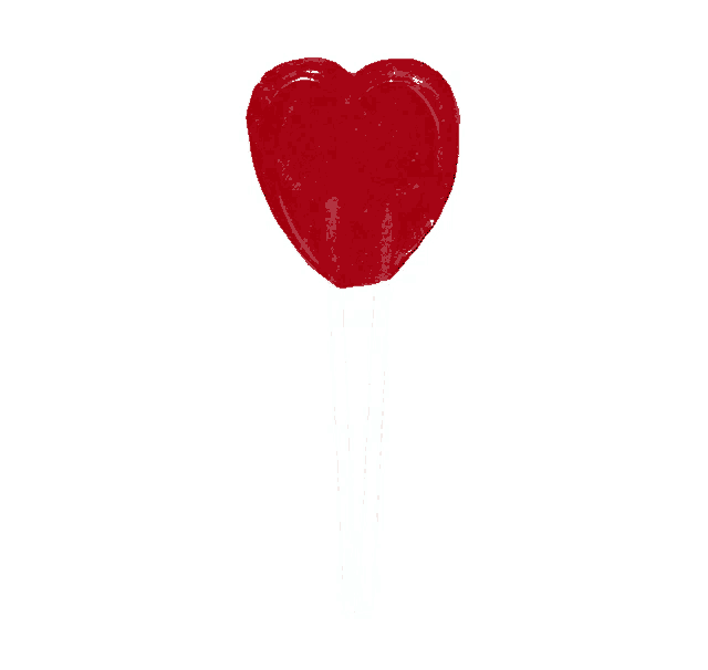 a broken heart shaped lollipop with two white sticks