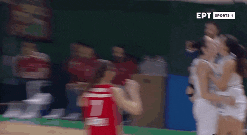 a blurry image of a basketball game being broadcasted by ept sports 1