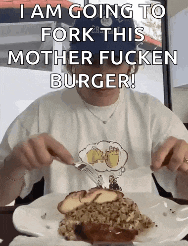 a man in a white shirt is eating a hamburger with the words i am going to fork this mother fucken burger