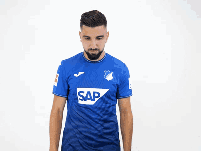 a man wearing a blue shirt that says sap