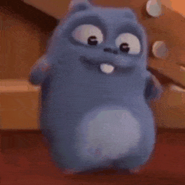 a cartoon character from the movie greedy is dancing on a wooden floor .