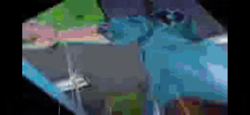 a blurred image of a person 's face with a blue background