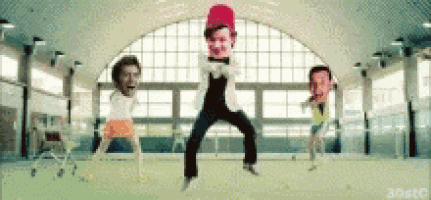 a group of people are dancing in a room with their faces on their heads .