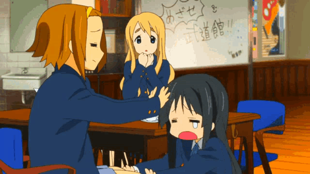 two anime girls are sitting at a table in front of a white board that says ' karate ' on it