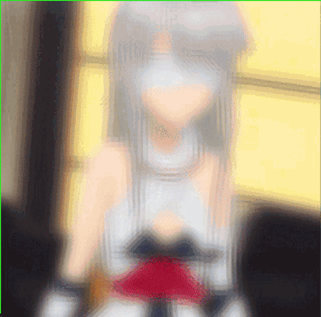 a blurry picture of a girl in a white and red dress
