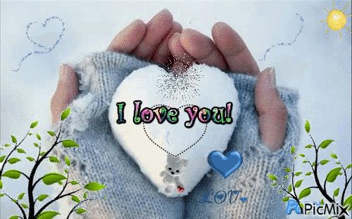 a person holding a heart with the words i love you written on it