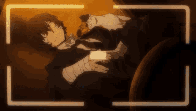 a man with a bandage on his arm is laying down with a cat on his lap