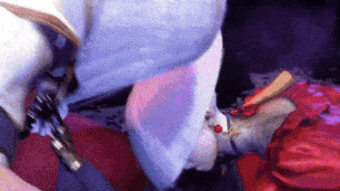 a close up of a person 's face with a purple background and a purple umbrella .