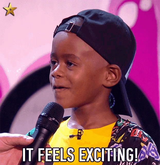 a young boy speaking into a microphone with the words " it feels exciting " above him