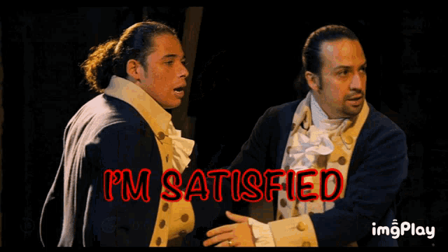 two men are standing next to each other with i 'm satisfied written in red letters