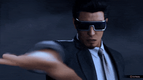 a man in a suit and tie is wearing a pair of sunglasses with an end replay button on the bottom right