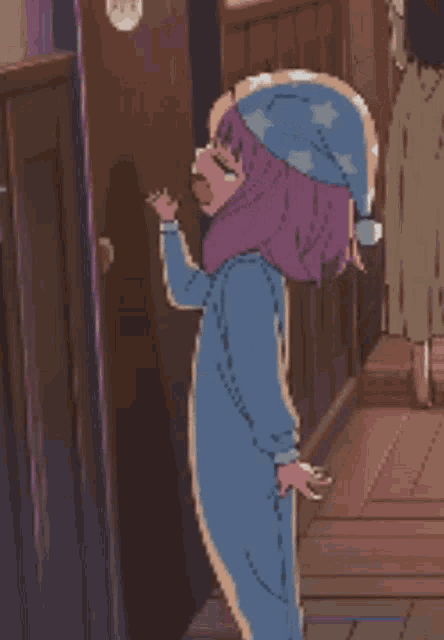 a pixel art drawing of a girl wearing a pajama hat