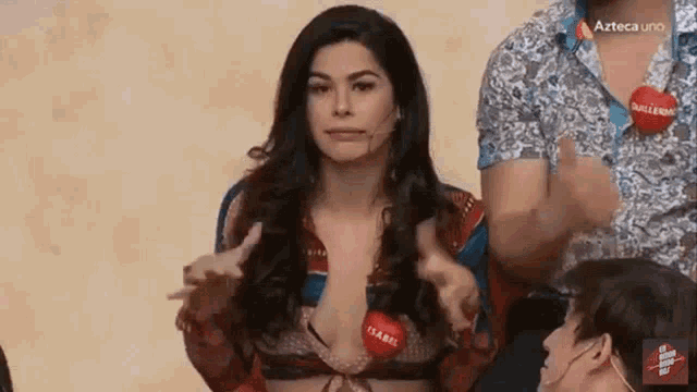 a woman in a bikini with a red tag that says isabel on it