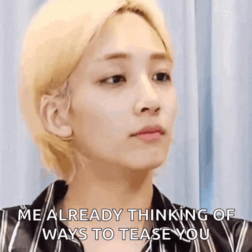 a close up of a person 's face with a caption that says `` me already thinking of ways to tease you ''