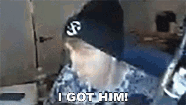 a person wearing a black beanie says " i got him "