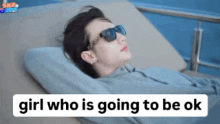 a woman wearing sunglasses is laying on a beach chair with the words girl who is going to be ok written below her